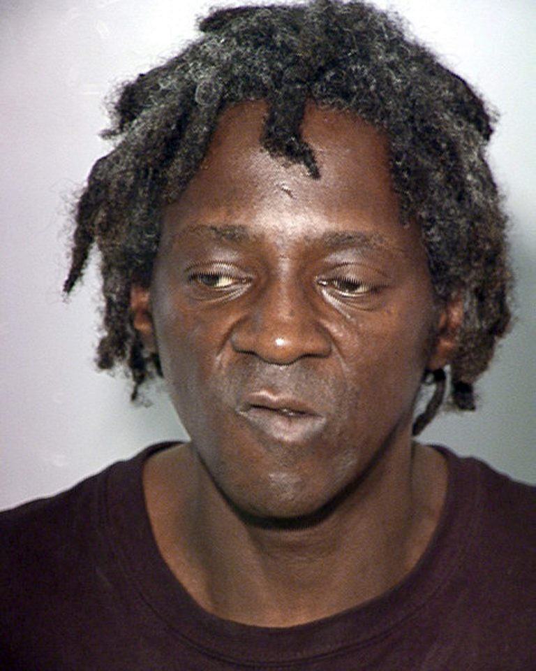 FILE - This Oct. 17, 2012, file photo, provided by the Las Vegas Police Department shows rapper Flavor Flav, whose name is William Jonathan Drayton Jr., in a police booking photo in Las Vegas. A judge in Las Vegas is expected to hear evidence in a felony case Wednesday, April 10, 2013, alleging entertainer Flavor Flav attacked his longtime girlfriend and her teenage son last October. (AP Photo/Las Vegas Police Department, File)