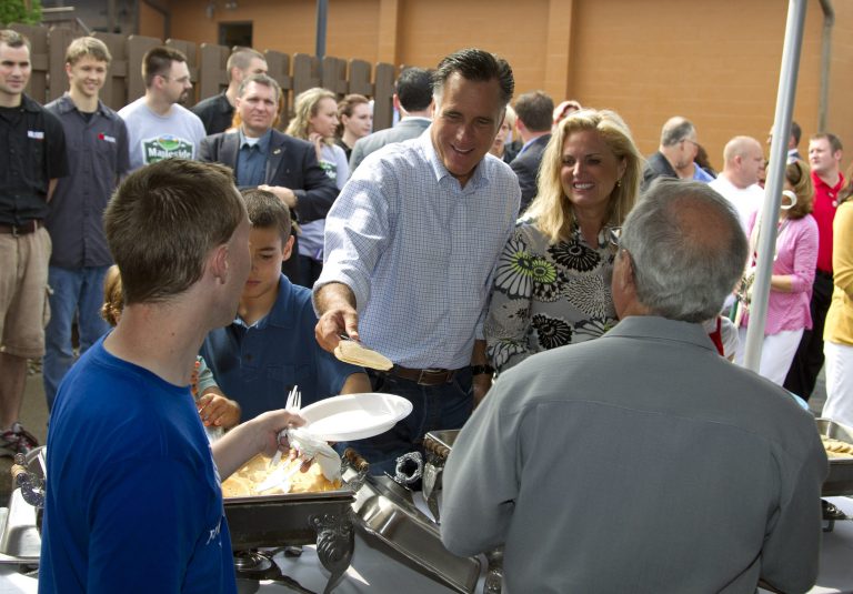   Republican presidential candidate, former Massachusetts Gov. Mitt Romney, left, serves pancakes with his wife Ann, during a campaign stop at Mapleside Farms Sunday, June 17, 2012, in Brunswick, Ohio. (AP Photo/Evan Vucci)  