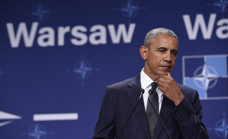 The president must take his focus off NATO to return to a country divided. (AP Photo/Susan Walsh)