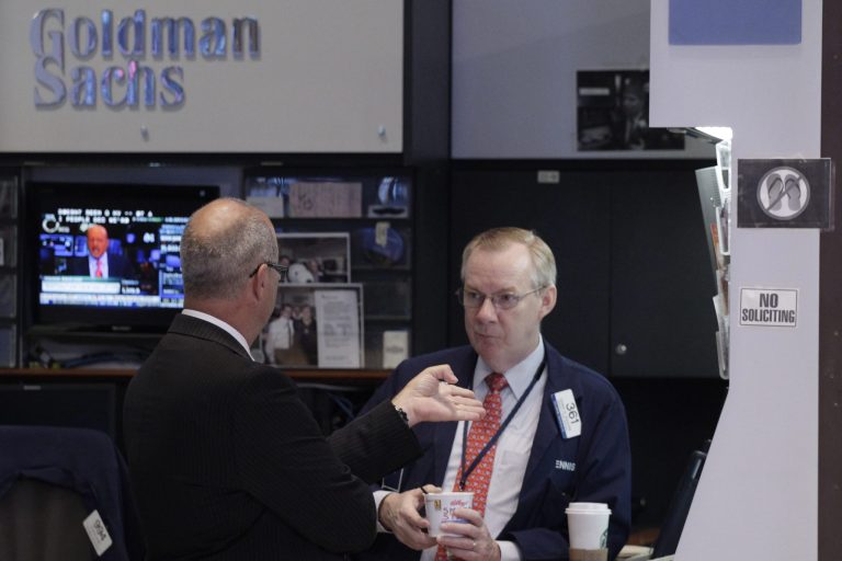 FILE - In this Aug. 19, 2013, file photo, stock traders work at the Goldman Sachs post at the New York Stock Exchange in New York. Goldman Sachs Group Inc. reports quarterly earnings on Tuesday, July 15, 2014. (AP Photo/Mark Lennihan, File)