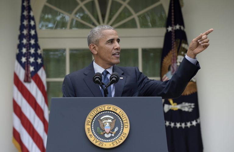 President Barack Obama acknowledges one of his staff members as he speaks about the Paris Agreement from the Rose Garden of the White House in Washington, Wednesday, Oct. 5, 2016. (AP Photo/Susan Walsh)