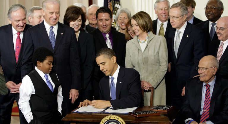In this March 23, 2010 file photo, President Obama signs the Affordable Care Act into law. (AP/J. Scott Applewhite)