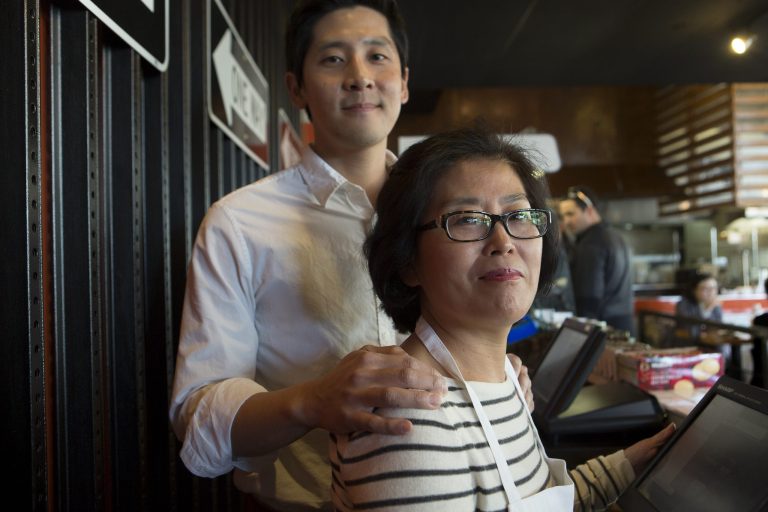 Janice Choi and her son, David Choi, run G Street Food on the ground floor of the Consumer Financial Protection Bureau building. (Examiner/Graeme Jennings)