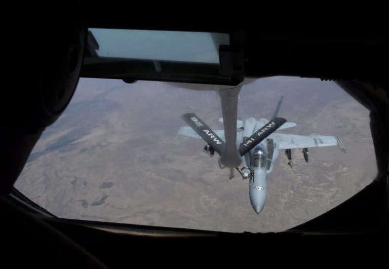 A U.S F-18 fighter refuels over Iraq. As of March 10, 2015 (date of this photo) U.S. planes have handled 80 percent of the campaigns's airstrikes. (AP Photo/Razan Alzayani)