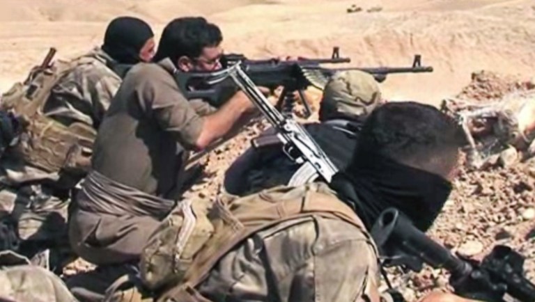In this Tuesday, June 17, 2014 image taken from video obtained from British Broadcaster Sky, which has been authenticated based on its contents and other AP reporting, Kurdish soliders aim their weapons towards positions held by fighters of the Islamic State of Iraq and the Levant near Jalula, Iraq. Kurdish security forces are engaged in gun battles with Sunni militants in the northern Iraqi town of Jalula, according to British Broadcaster Sky. Footage showed Kurdish fighters known as peshmerga using heavy artillery and rockets to attack militant positions on Tuesday. (AP Photo/Sky via AP video)