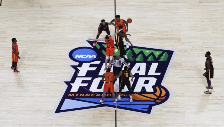 Players get set for the opening tip during the College All-Star Game the Final Four NCAA college basketball tournament, Friday, April 5, 2019, in Minneapolis. 