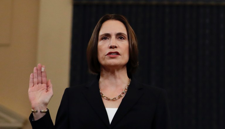 Former White House national security aide Fiona Hill, left, and David Holmes, a U.S. diplomat in Ukraine, are sworn in to testify before the House Intelligence Committee on Capitol Hill in Washington, Thursday, Nov. 21, 2019, during a public impeachment hearing of President Donald Trump's efforts to tie U.S. aid for Ukraine to investigations of his political opponents.