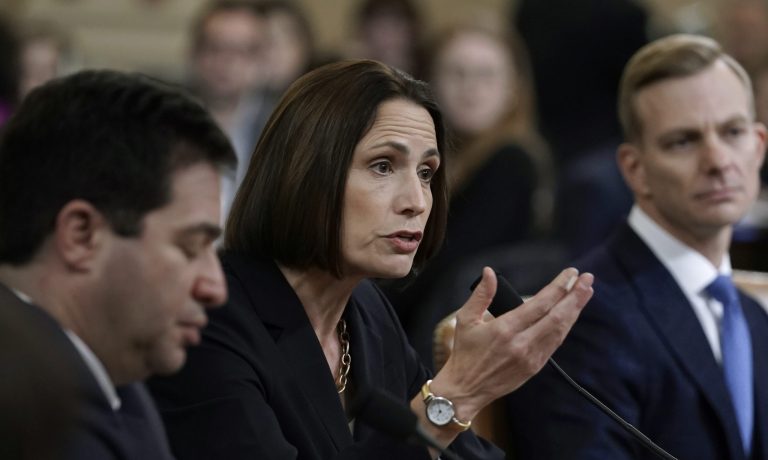 Former White House national security aide Fiona Hill, center, and David Holmes, right, a U.S. diplomat in Ukraine, testify before the House Intelligence Committee on Capitol Hill in Washington, Thursday, Nov. 21, 2019, during a public impeachment hearing of President Donald Trump's efforts to tie U.S. aid for Ukraine to investigations of his political opponents.