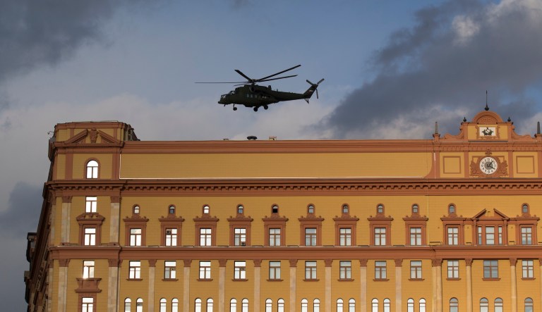 Russian military Mi-35 helicopter takes off from the building of the Federal Security Service (FSB, Soviet KGB successor) in Lubyanskaya Square in Moscow, Russia, Friday, Feb. 26, 2016. Russian President Vladimir Putin attended a meeting with top officials of the Federal Security Service on Friday.
