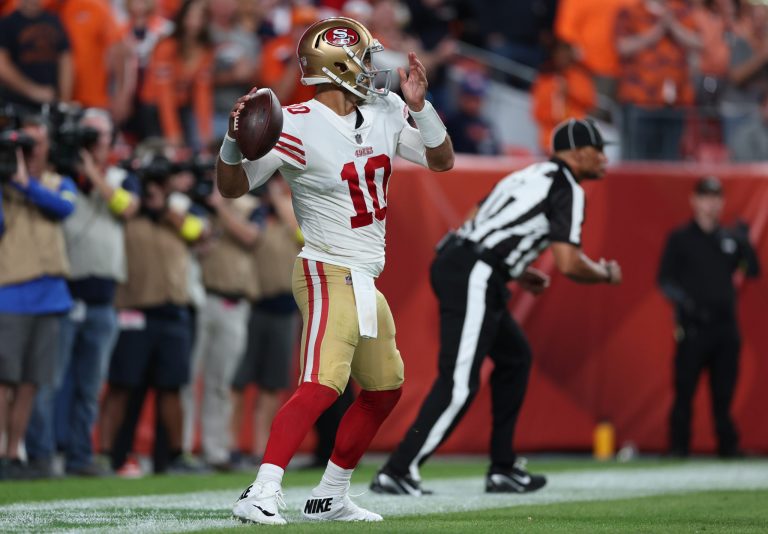 Jimmy Garoppolo #10 of the San Francisco 49ers steps out of the back of the end zone resulting in a safety during the third quarter against the Denver Broncos at Empower Field At Mile High on September 25, 2022 in Denver, Colorado.