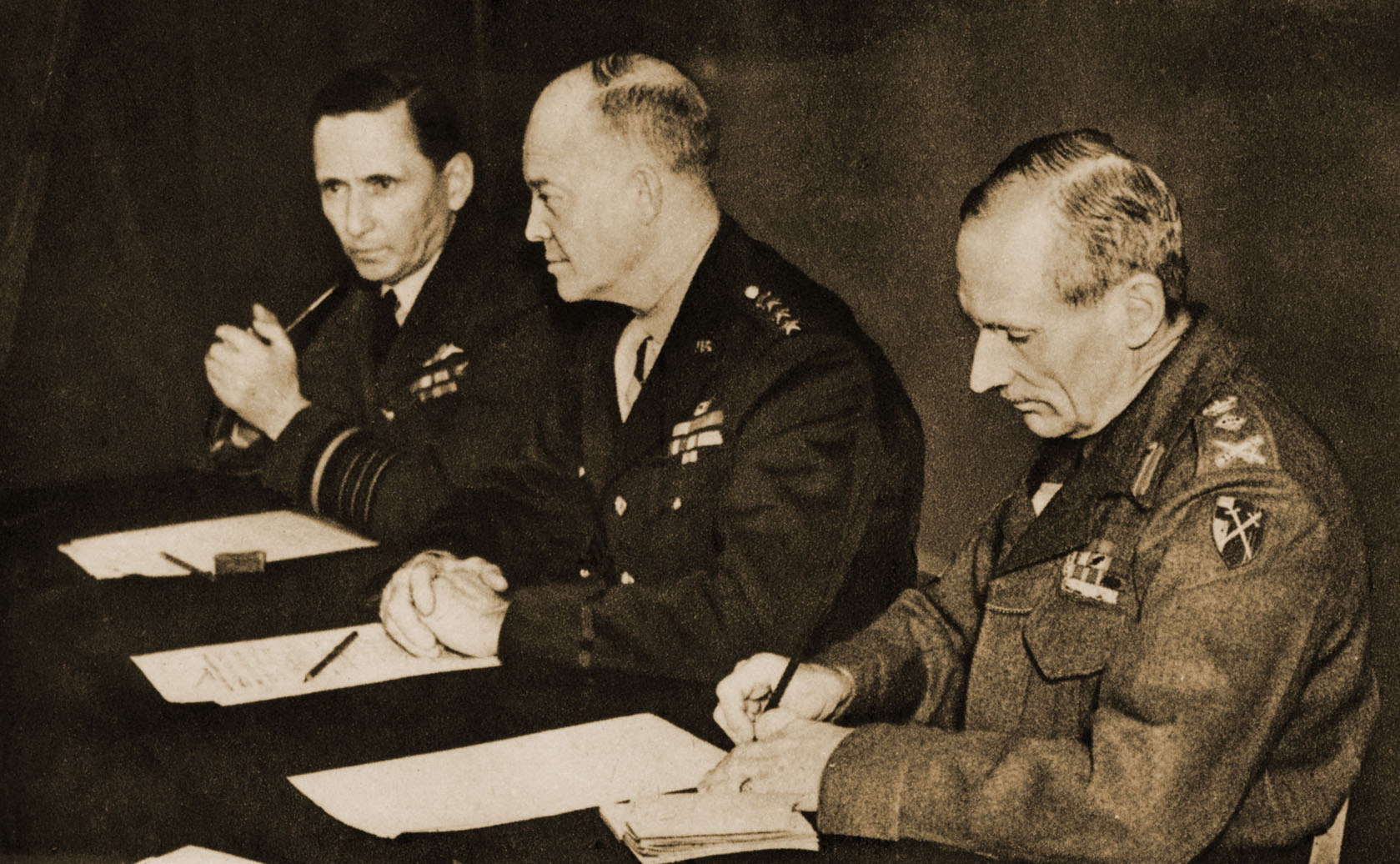 Allied Leaders: Air Chief Marshal Sir Arthur Tedder, General Dwight D. Eisenhower, and General Sir Bernard Montgomery.