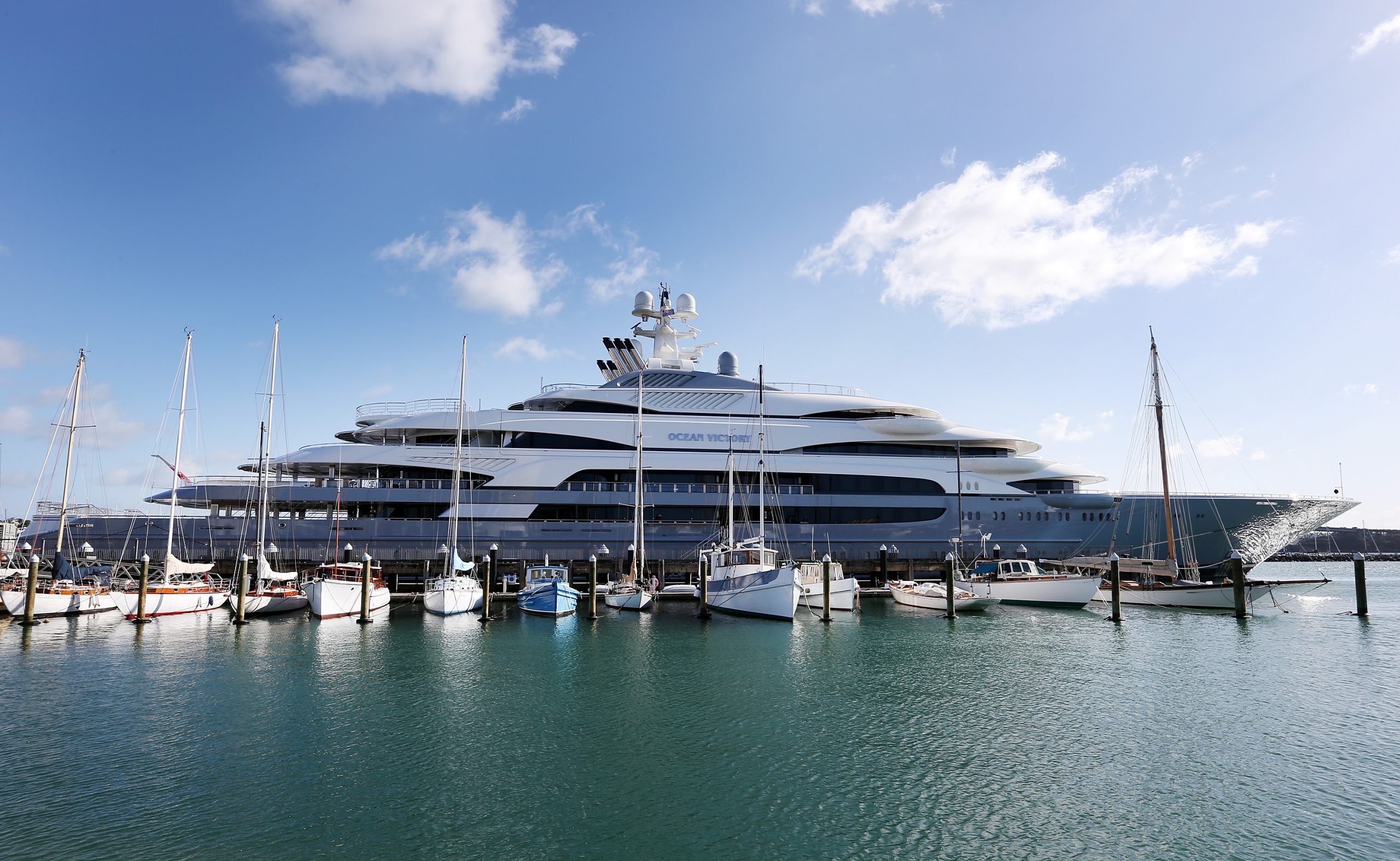 The 140-meter long 'Ocean Victory' is seen docked on July 21, 2015, in Auckland, New Zealand. The superyacht is owned by Russian steel billionaire Viktor Rashnikov and features six swimming pools, a jacuzzi, a gym, a helipad, and a helicopter hanger.