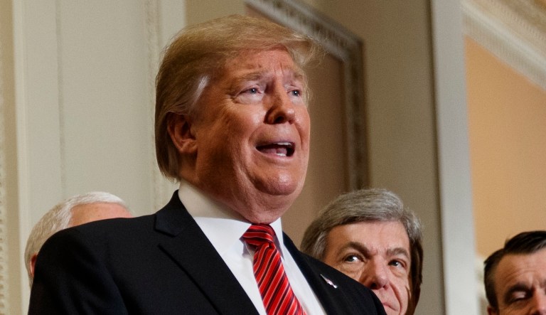 President Trump talks with reporters after a Senate Republican policy lunch on Capitol Hill, Wednesday, Jan. 9, 2019, in Washington.