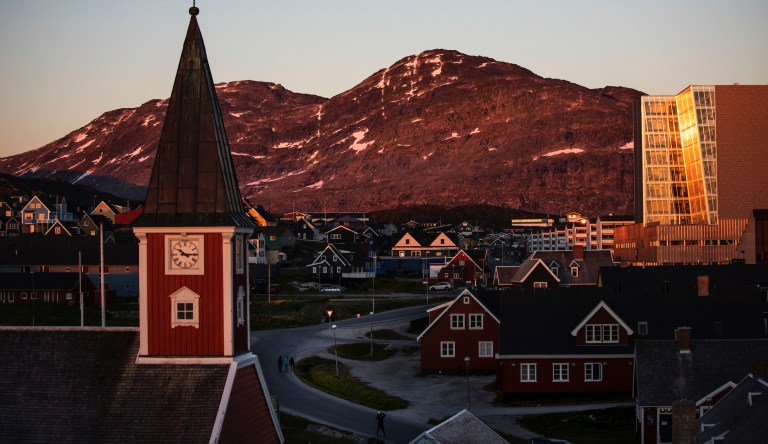 The sun sets over Nuuk, Greenland, Monday, July. 31, 2017. Arctic mining could benefit from a 'green shift' away from fossil fuels.                                                                                                     
