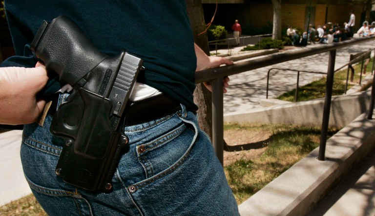 Brent Tenney displays his Glock 9mm semi-automatic handgun on the University of Utah campus where he is a student Wednesday, April 25, 2007, in Salt Lake City. Tenney says he feels relatively safe when he goes to class at the university, but the 24-year-old business major doesn't want to take any chances -- he brings a loaded weapon to school every day. Utah has the nation's only state law that expressly allows the carrying of concealed weapons at public colleges.