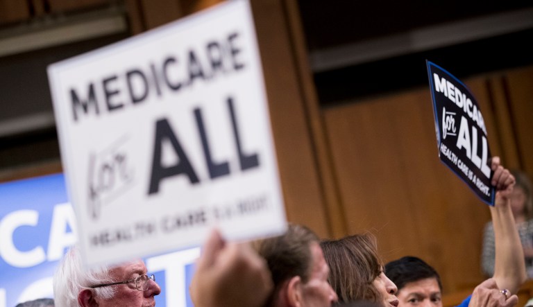 Sen. Bernie Sanders, I-Vt., left, pauses as he and other Democratic Senators hold a news conference on Capitol Hill in Washington, Wednesday, Sept. 13, 2017, to unveil their Medicare for All legislation to reform healthcare.