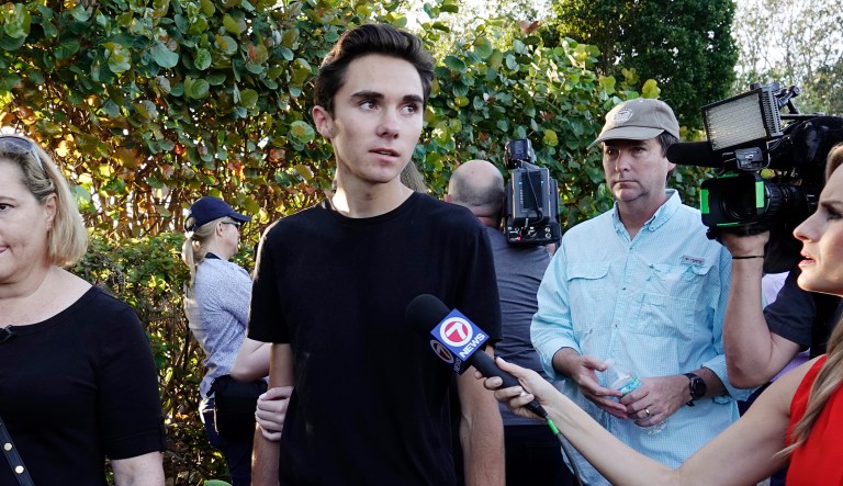 FILE - In this Feb. 28, 2018, file photo, student David Hogg speaks to the media as he returns to Marjory Stoneman Douglas High School in Parkland, Fla. Speaking on a Twitter livestream on Monday, March 19, Hogg said the Marjory Stoneman Douglas High School shooting survivors are not pushing a liberal or conservative agenda. But he said they âhave to use our white privilegeâ to make sure all people who have died in gun violence can be heard.