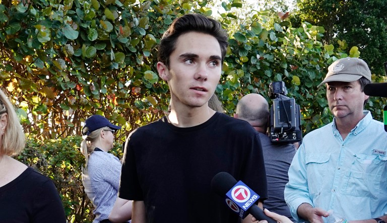 Student David Hogg speaks to the media as he returns to Marjory Stoneman Douglas High School in Parkland, Fla., Wednesday, Feb. 28, 2018.
