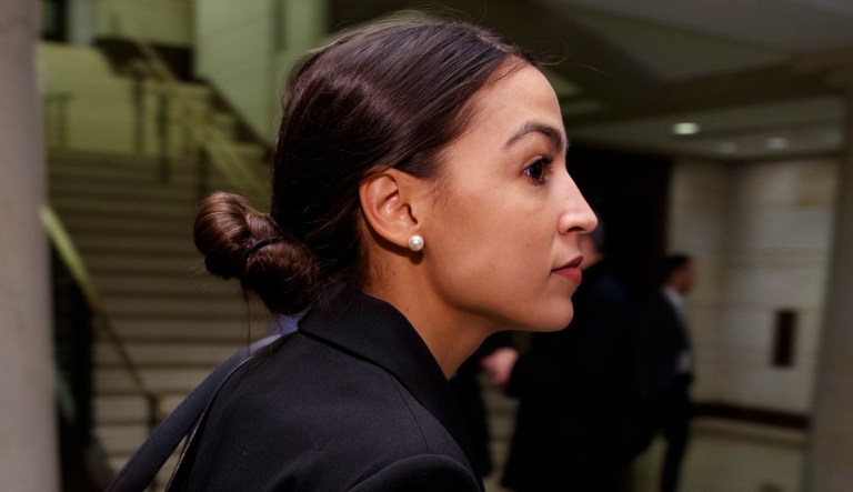 Rep.-elect Alexandria Ocasio-Cortez, D-N.Y., walks to member-elect briefings on Capitol Hill in Washington, Thursday, Nov. 15, 2018.