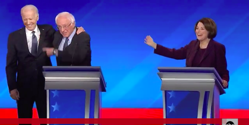 Biden hugs Bernie Sanders at New Hampshire debate