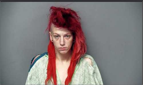 Woman charged for running naked on football field while high on heroin in front of eighth graders