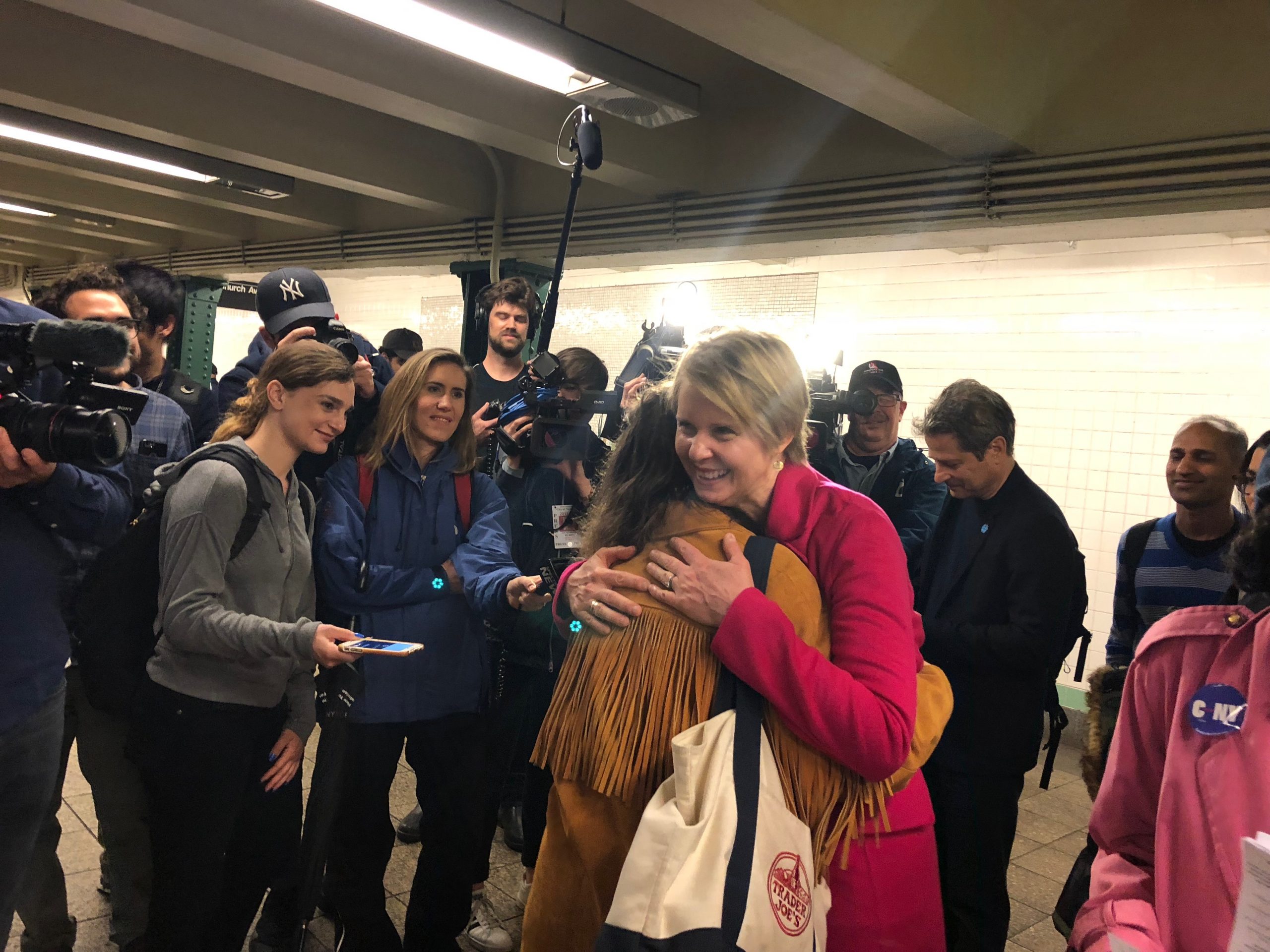 Cynthia Nixon hugs a voter