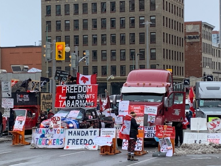 Ottawa police arrest dozens of protesters, start towing rigs