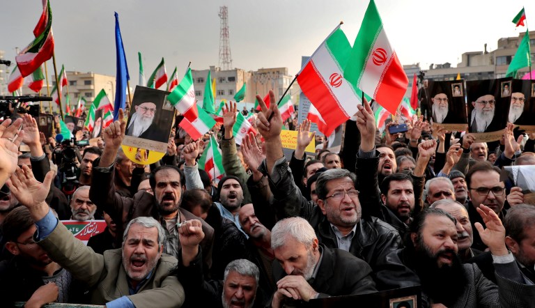 Demonstrators chant slogans during a pro-government rally denouncing last weekâs violent protests over a fuel price hike, in Tehran, Iran, Monday, Nov. 25, 2019. 