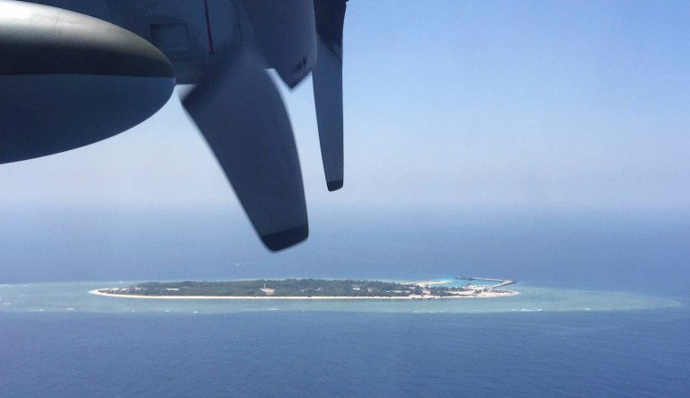 In this March 23, 2016, file photo, an aerial view is seen from a military plane carrying international journalists of the Taiwan-controlled Taiping island, also known as Itu Aba, in the Spratly archipelago, roughly 1,000 miles in the South China Sea of southern Taiwan. Tensions in the South China Sea are rising, pitting China against smaller and weaker neighbors who all lay claim to a string of isles, coral reefs and lagoons, rich in fish and potential gas and oil reserves.