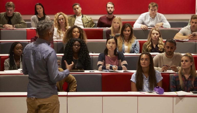 Back view of students attending a lecture.