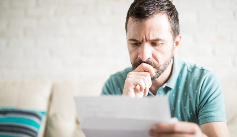 A man worried about making payments.