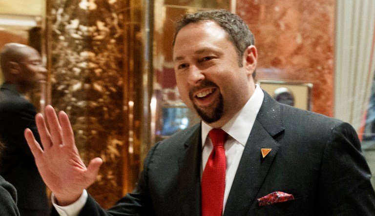 In this Nov. 29, 2016 photo, Jason Miller, Communications Director of President-elect Donald J. Trump's Transition Team, waves to reporters in the lobby of Trump Tower in New York. President-elect Donald Trump has named his senior communications team, choosing Sean Spicer as press secretary, Jason Miller as communications director, Hope Hicks as director of strategic communications and Daniel Scavino as director of Social Media.
