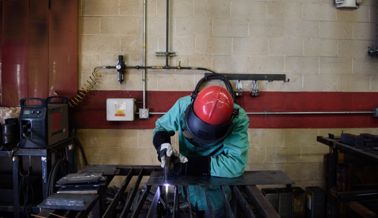 A student practices plasma cutting during a class at the Penn Commercial Business/Technical School in Washington, Pennsylvania, U.S., on Tuesday, Aug. 15, 2017.