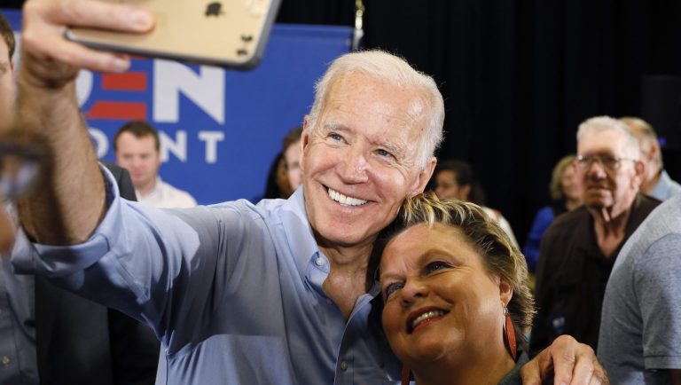 Democratic presidential candidate former Vice President Joe Biden poses for a photo with an audience member after speaking at Clinton Community College, Wednesday, June 12, 2019, in Clinton, Iowa.