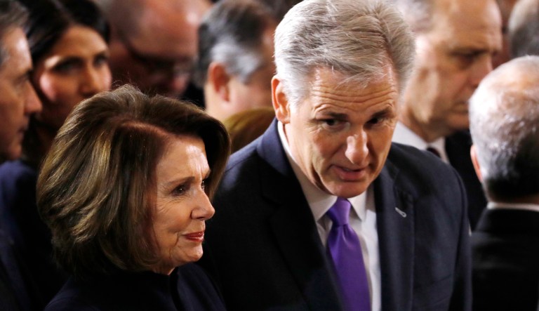 House Majority Leader Kevin McCarthy, right, speaks with House Minority Leader Nancy Pelosi, as they wait for the start of ceremonies where the Rev. Billy Graham will lie in honor in the Rotunda of the Capitol, Wednesday, Feb. 28, 2018 in Washington.