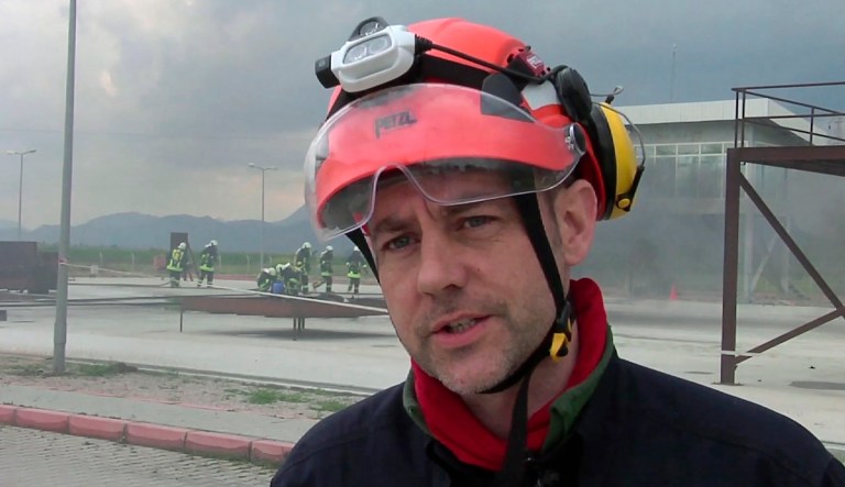 FILE - In this image taken from file video, showing James Le Mesurier, founder and director of Mayday Rescue, talks to the media during training exercises in southern Turkey, March 19, 2015.  Turkey's state-run news agency report Monday Nov. 11, 2019, that a former British army officer who helped found the "White Helmets" volunteer organisation in Syria, has been found dead in Istanbul.