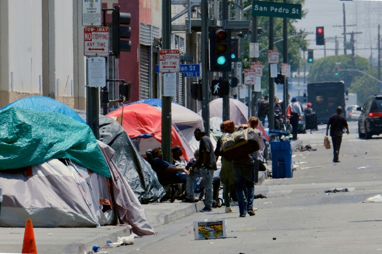 FILE - In this May 30, 2019 file photo, tents housing homeless line a street in downtown Los Angeles. 