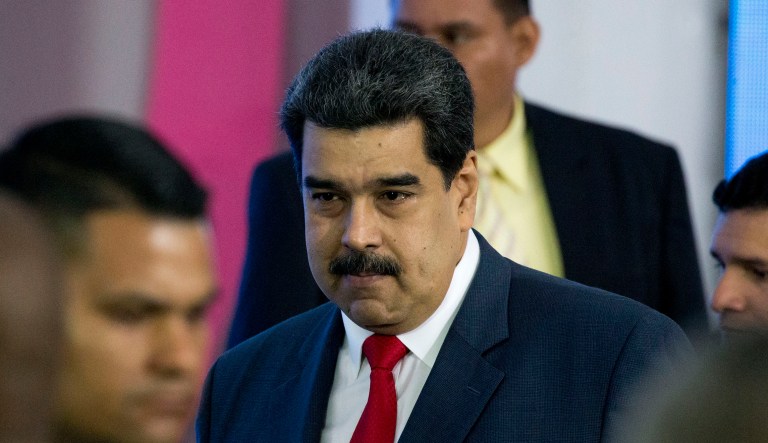 Venezuela's President Nicolas Maduro leaves at the end of the closing ceremony of the International Tourism Fair in Caracas, Venezuela, Monday, Nov. 26,2018. The United Nations has released $9.2 million for food, medicine and other help for struggling Venezuelans through an emergency relief fund, the first such assistance during the country's deepening a political and economic crisis.