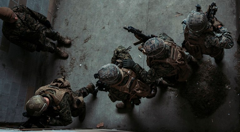 U.S. Marines with Mobility Assault Company, 2d Combat Engineer Battalion, 2d Marine Division, clear a room as part of a close quarters training during Exercise Bold Quest 21.2 at Muscatatuck Urban Training Center, Ind., Nov. 15, 2021. The exercise is a joint and multinational operational assessment and demonstration to improve technical and procedural tactical-level sensor-to-shooter interoperability. 
