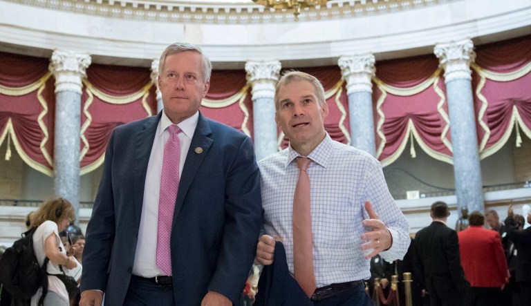 Rep. Mark Meadows, R-N.C., chairman of the conservative House Freedom Caucus, and Rep. Jim Jordan, R-Ohio, a key member of the group, walk through Statuary Hall at the Capitol in Washington, Wednesday, Sept. 13, 2017. With President Donald Trump wanting a legislative solution to replace the Deferred Action for Childhood Arrivals program, Meadows has said he will put together a working group to craft a conservative immigration plan.