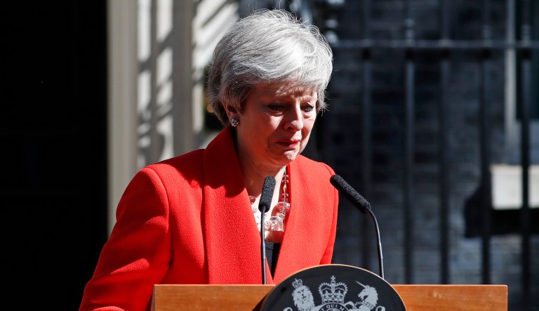 British Prime Minister Theresa May reacts as she turns away after making a speech in the street outside 10 Downing Street in London, England, Friday, May 24, 2019. Theresa May says she'll quit as UK Conservative leader on June 7, sparking contest for Britain's next prime minister.