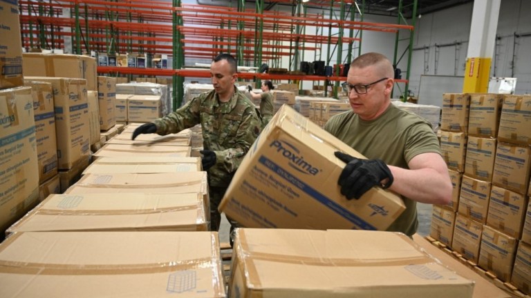U.S. Air National Guard ground transportation specialists with the 175the Logistics Readiness Squadron prepare and load boxes of medical supplies and equipment March 19, 2020 at the Maryland Strategic National Stockpile location. 