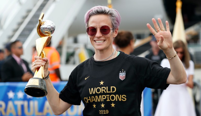 United States women's soccer team member Megan Rapinoe holds the Women's World Cup trophy after arriving at Newark Liberty International Airport, Monday, July 8, 2019, in Newark, N.J. 