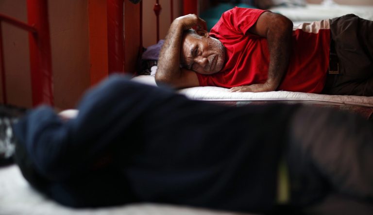 Construction worker Santiago Martinez, 59, a migrant from Honduras, rests in a migrant shelter, Thursday, Aug. 26, 2010.