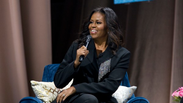 Former first lady Michelle Obama speaks to the crowd as she presents her anticipated memoir "Becoming" during her book tour stop in Washington, Saturday, Nov. 17, 2018. (AP Photo/Jose Luis Magana)