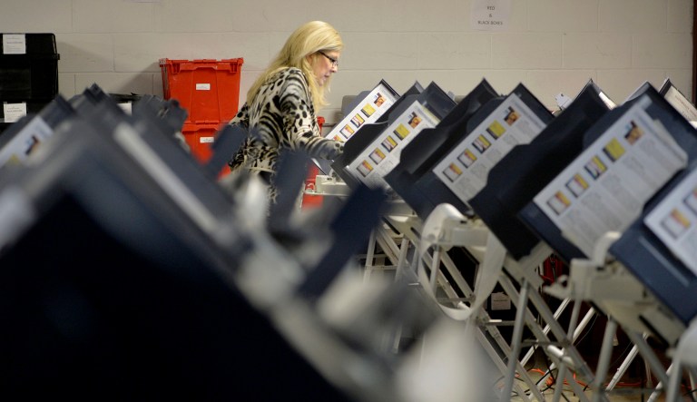 Richmond County Board of Elections Executive Director Lynn Bailey tests voting machines Monday, Nov. 26, 2018 in Augusta, Ga., as she prepares for advance voting in the upcoming runoff election.