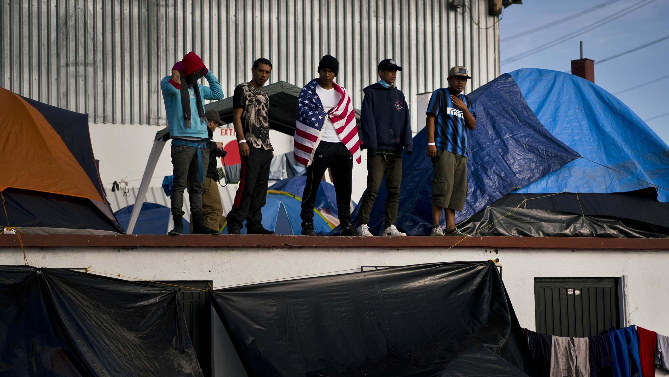 Migrants moved farther from US-Mexico border after Tijuana shelter gets shut down