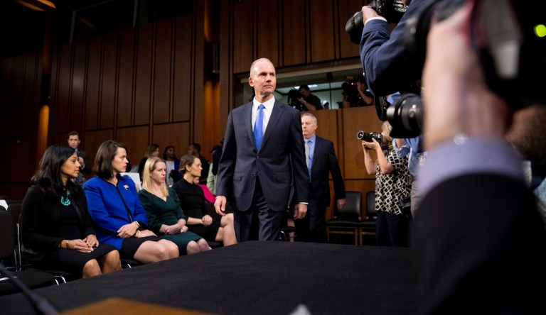 Boeing Company President and Chief Executive Officer Dennis Muilenburg, left, and Boeing Commercial Airplanes Vice President and Chief Engineer John Hamilton, right, arrive to testify before a Senate Transportation Committee hearing on 'Aviation Safety and the Future of Boeing's 737 MAX' on Capitol Hill in Washington.