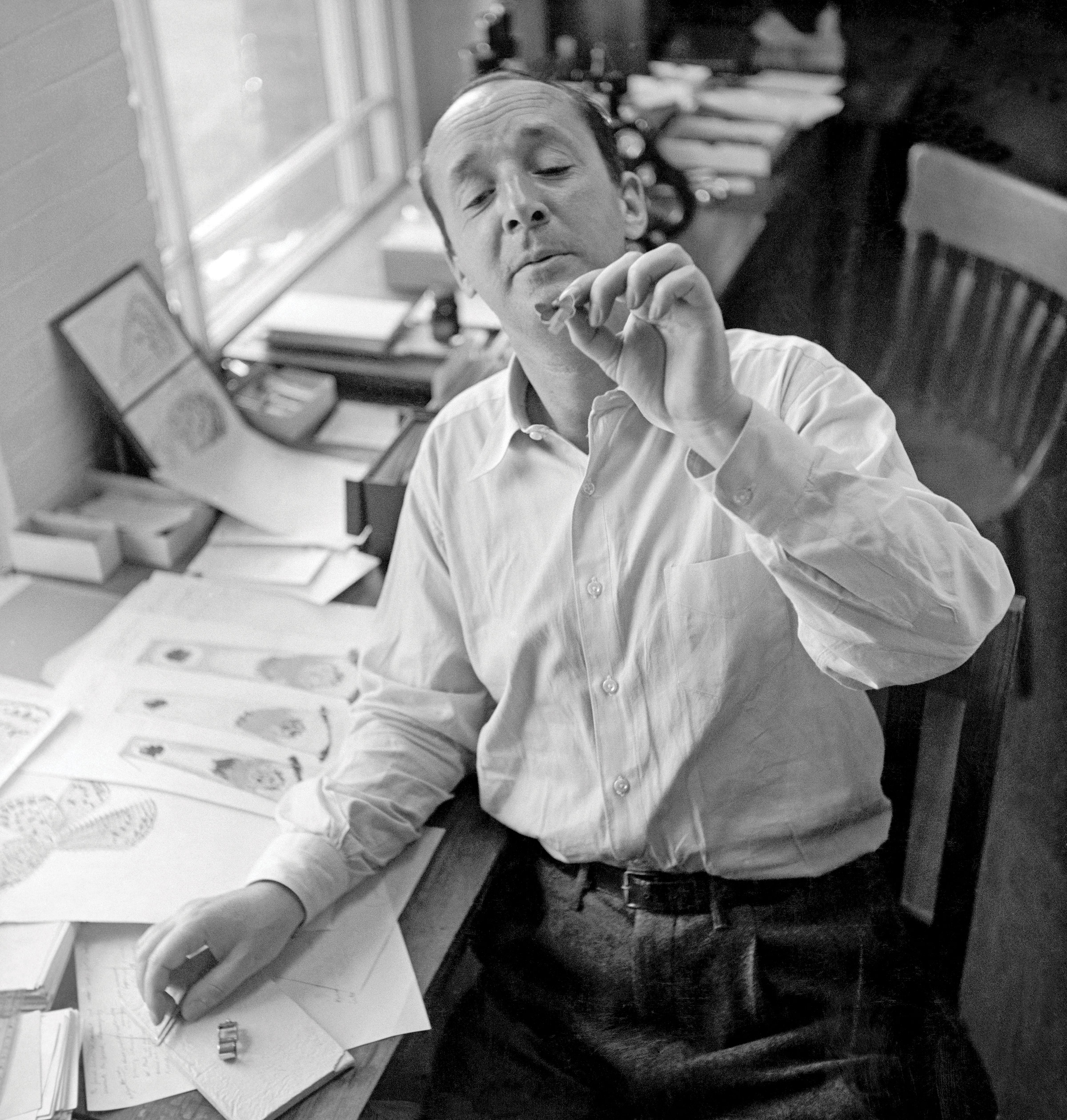 Vladimir Nabokov holding a butterfly at Harvard’s Museum of Comparative Zoology, where he was a fellow (1947).