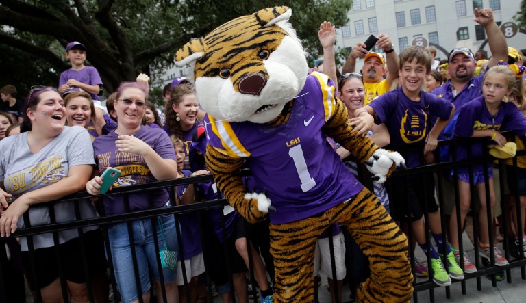 The Louisiana State University mascot Mike the Tiger entertains fans outside Tiger Stadium before a college football game against New Mexico State in Baton Rouge, La., Saturday, Sept. 27, 2014.